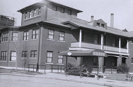 Exterior of the brick Armour & Company headquarters with a labeled entry awning